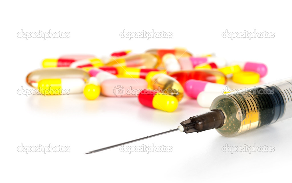 Pills and capsule with syring Stock Photo by ©urfingus 20147217