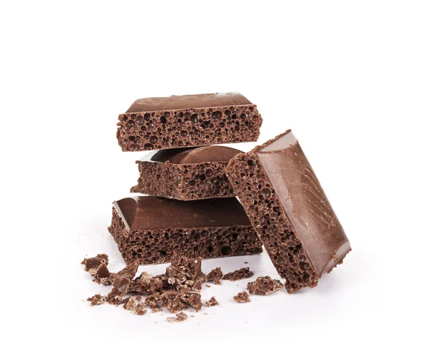 Close-up detail van chocolade delen op witte achtergrond — Stockfoto