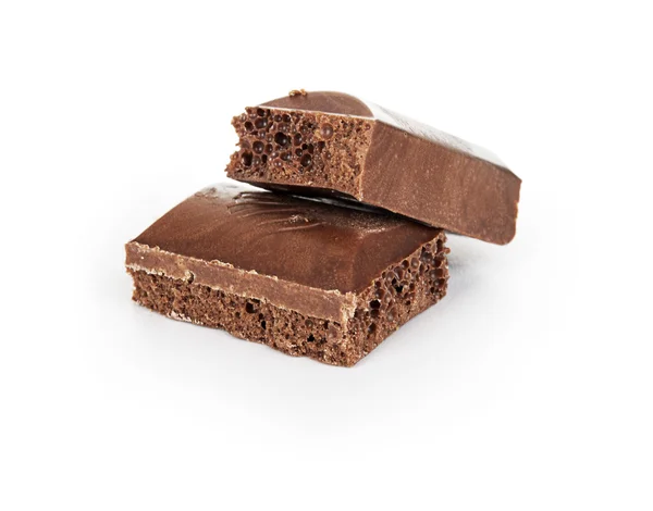 Close-up detail van chocolade delen op witte achtergrond — Stockfoto