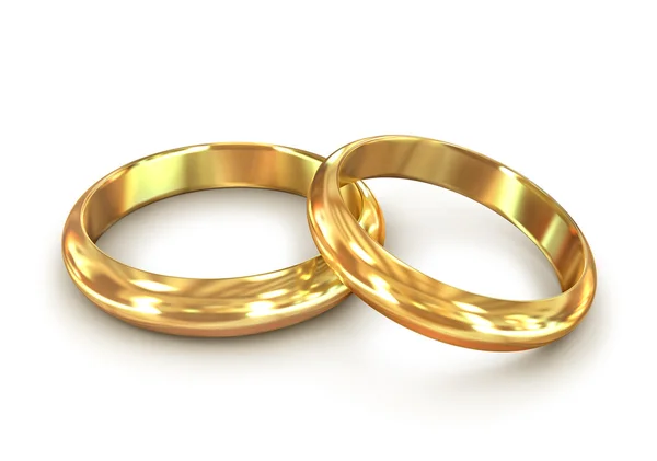 Pár zlatých snubních prstenů na bílém pozadí — Stock fotografie