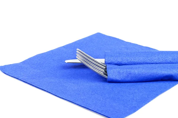 Fork and knife on blue napkin — Stock Photo, Image