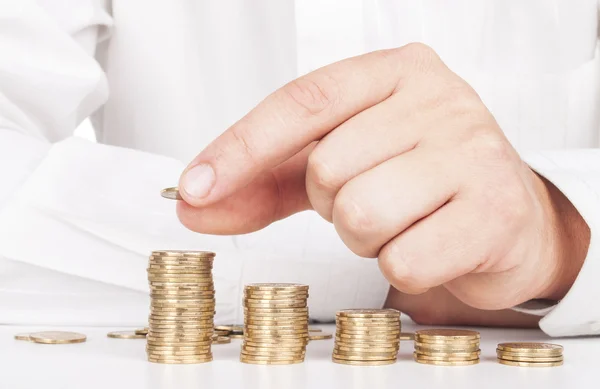 Coins diagram and hand — Stock Photo, Image