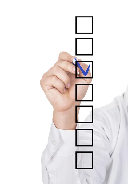 Human hand checking the checklist boxes — Stock Photo, Image