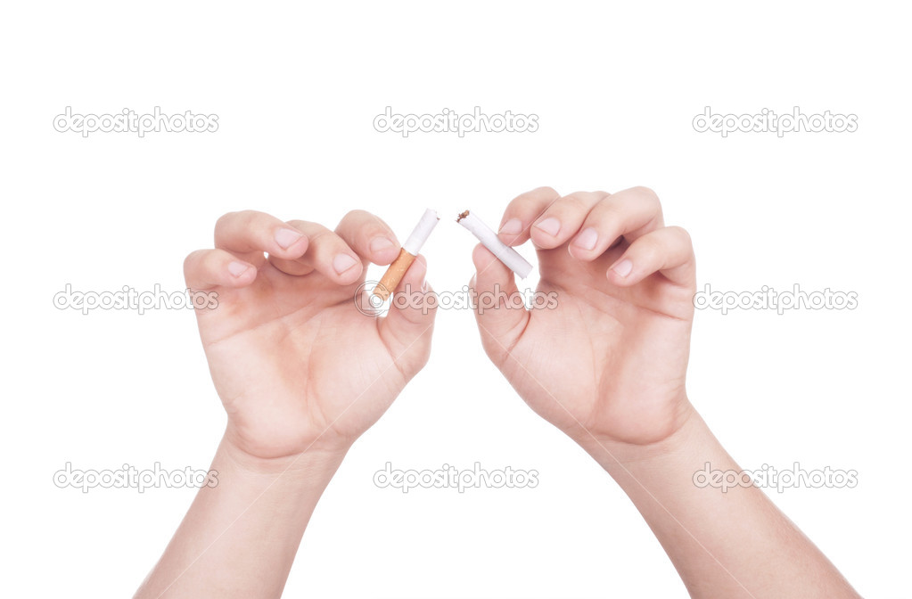 Hands breaking cigarette.