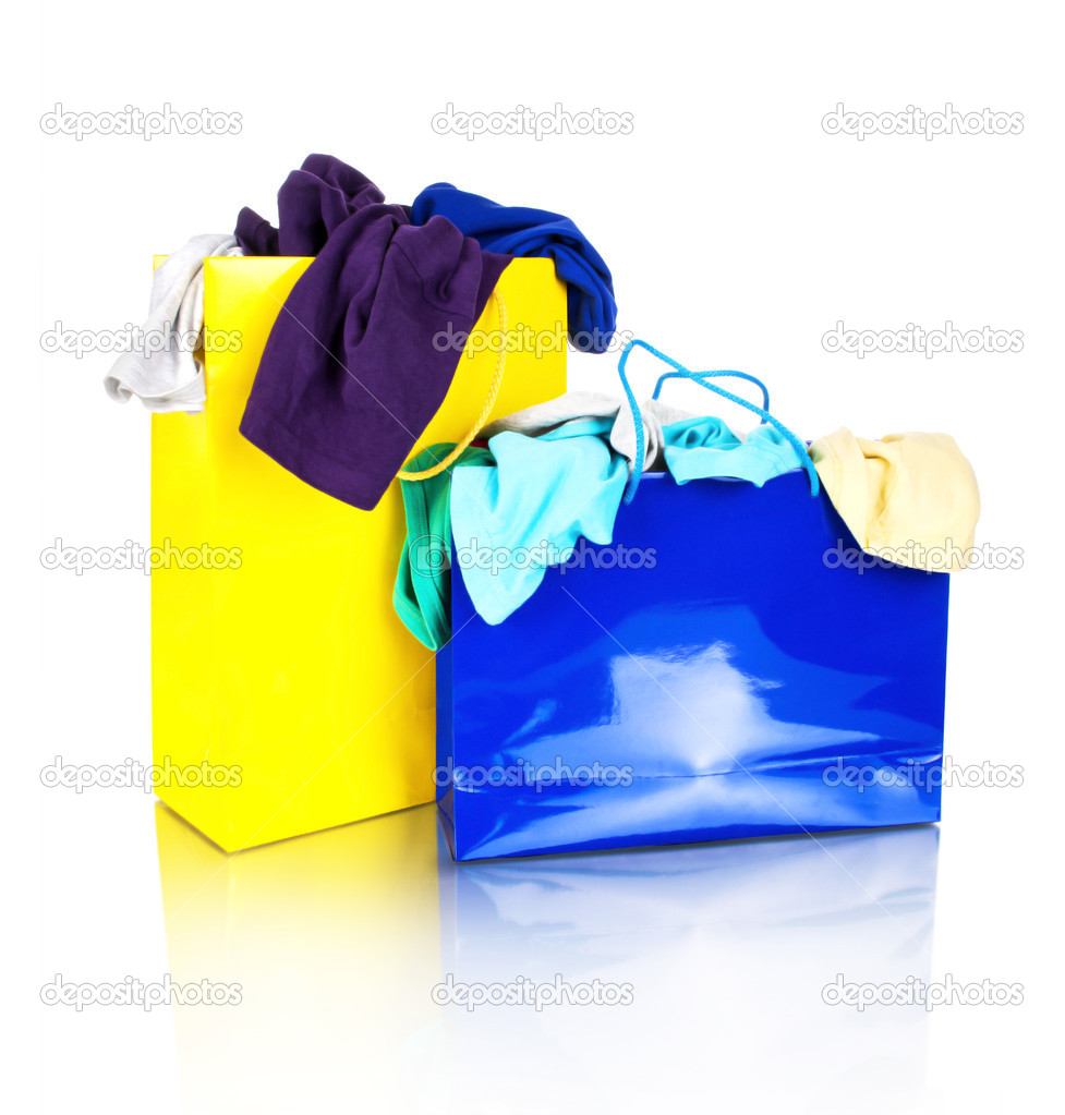 Paper shopping bags full of clothes