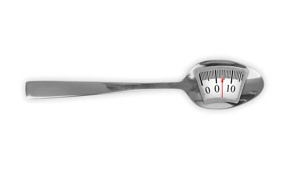 Ernährungsmahlzeit. Metalllöffel mit Gewichtswaage — Stockfoto