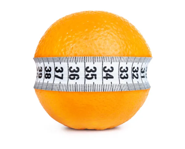 Turuncu meyve ile ölçüm — Stok fotoğraf