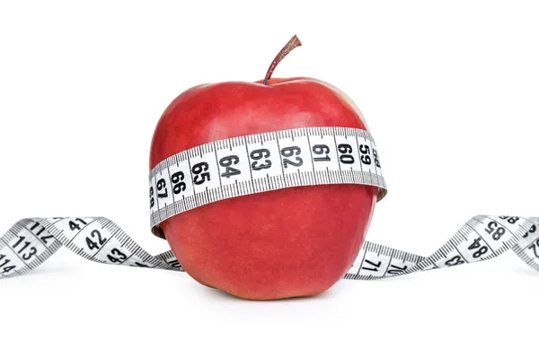 Apple with measure tape Royalty Free Stock Photos