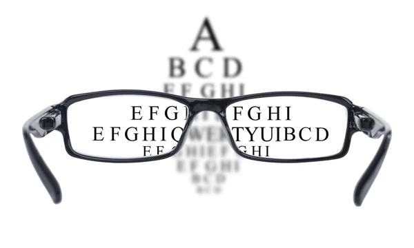 Sight test seen through eye glasses — Stock Photo, Image