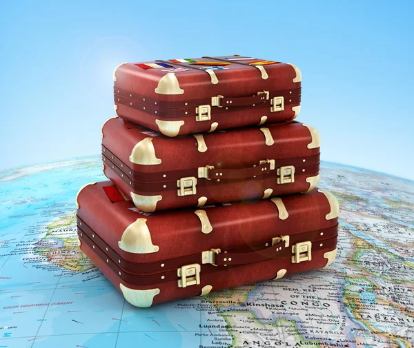 Travel suitcases in stack on global — Stock Photo, Image