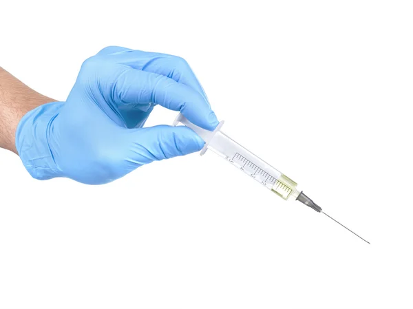 Hand in glove with syringe — Stock Photo, Image