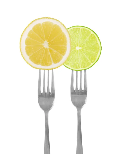 Sliced lime and lemon of forks — Stock Photo, Image
