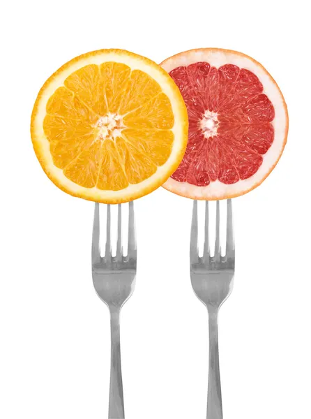 Citrinos em garfos, laranja, toranja — Fotografia de Stock