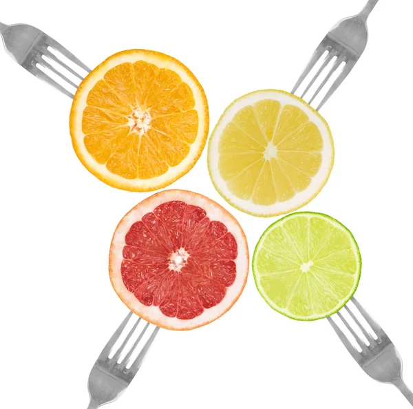 Citrusové plody na vidličky vápno, pomeranč, grapefruit, citron — Stock fotografie