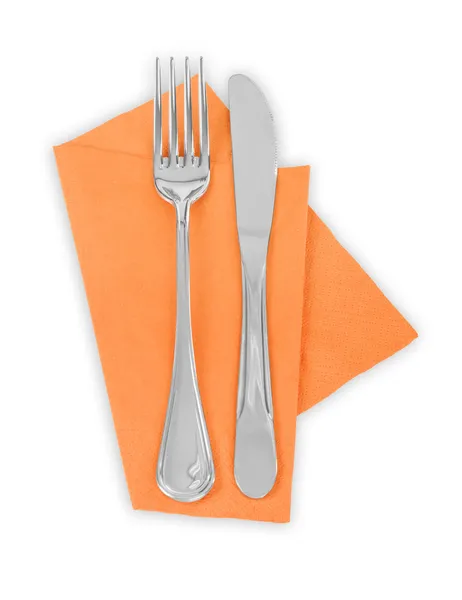 Fork and knife in a orange cloth — Stock Photo, Image