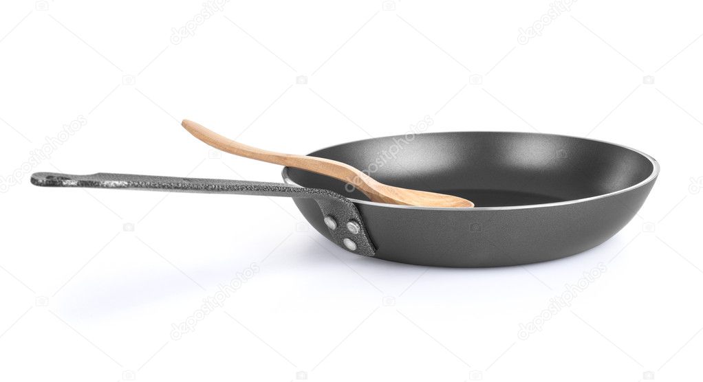 Frying pan with wooden spoon — Stock Photo © urfingus 41377423