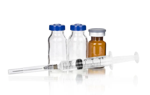 Medical ampoules and syringe — Stock Photo, Image