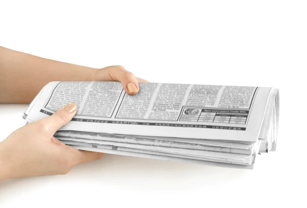 Kranten in de hand — Stockfoto