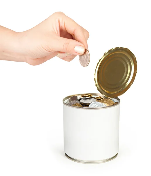 Металлическая жестянка для советов с деньгами и рукой — стоковое фото