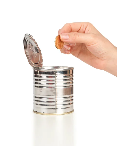 Metall tin för tips med pengar och hand — Stockfoto