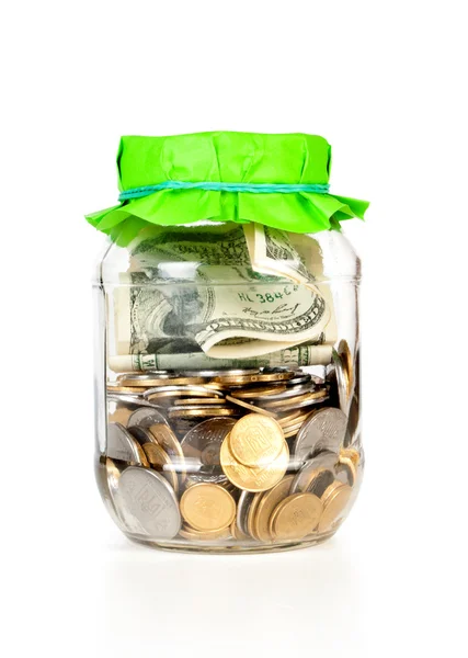 Glass bank for tips with coins — Stock Photo, Image