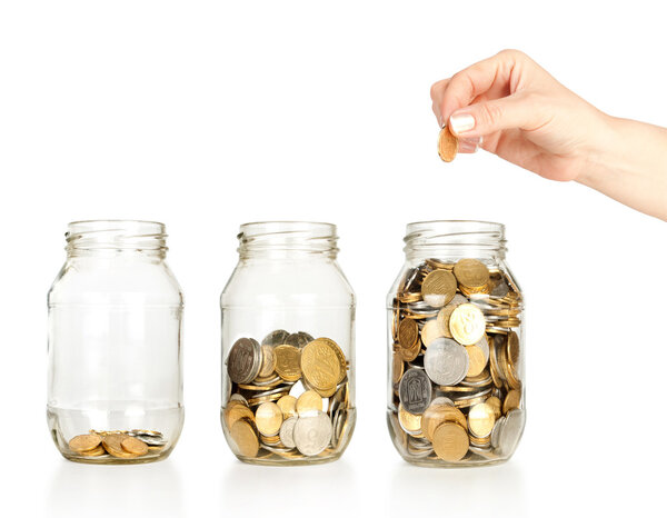 Банка с деньгами и рукой
