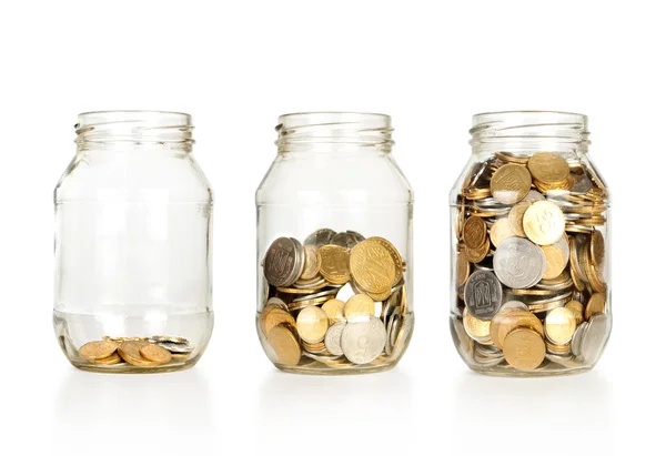 Glass jars with coins like diagram — Stock Photo, Image