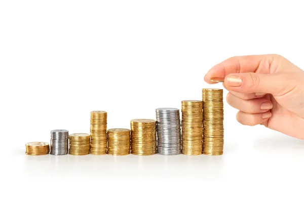 Coins in finger and row stacks — Stock Photo, Image