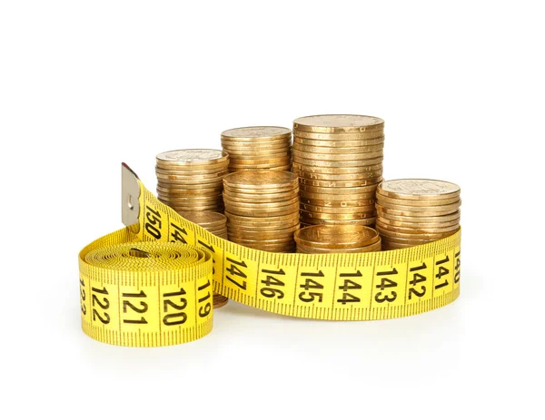 Stack of coins with tape measuring — Stock Photo, Image