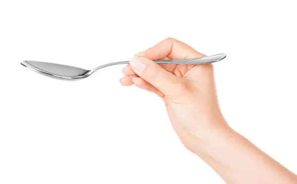 Spoon in hand — Stock Photo, Image
