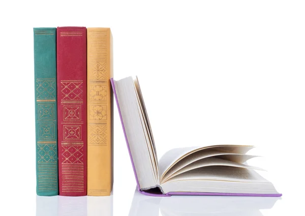 Stack of books with a pair of eyeglasses — Stock Photo, Image