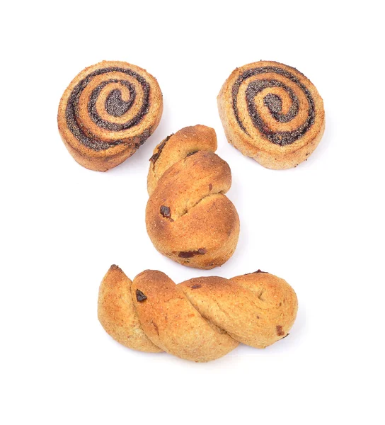 スパイラルのケシの実クッキー、クランベリーの三つ編みの顔 — ストック写真