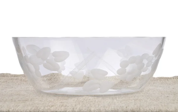 Чаша стекла на льняном белье — стоковое фото