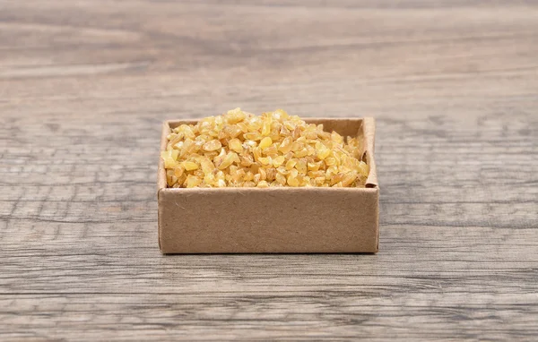 Bulgur on wood — Stock Photo, Image