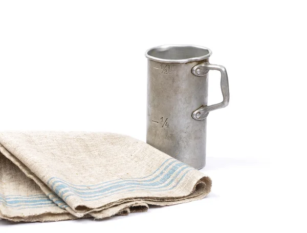 Graduated jug and linen — Stock Photo, Image