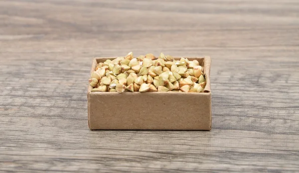 Buckwheat on wood — Stock Photo, Image