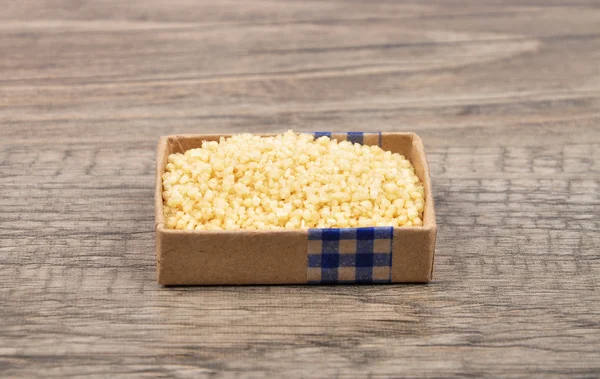 Couscous on wood — Stock Photo, Image