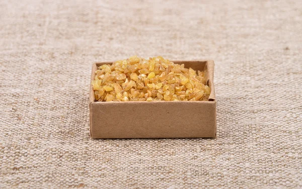 Bulgur on linen — Stock Photo, Image