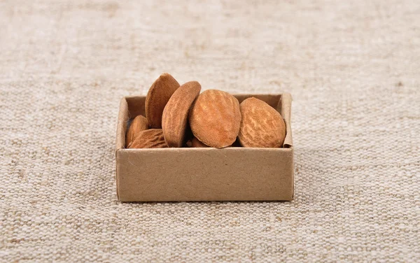 Almonds on linen — Stock Photo, Image