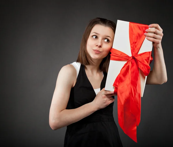 Happy young brunette girl with present — Stok Foto