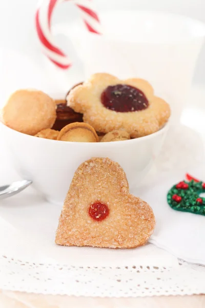 Christmas cookies decorated with jam on the white background Stock Image