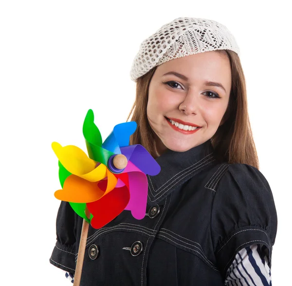 Young cute brunette girl with wind turbine toy — Stockfoto