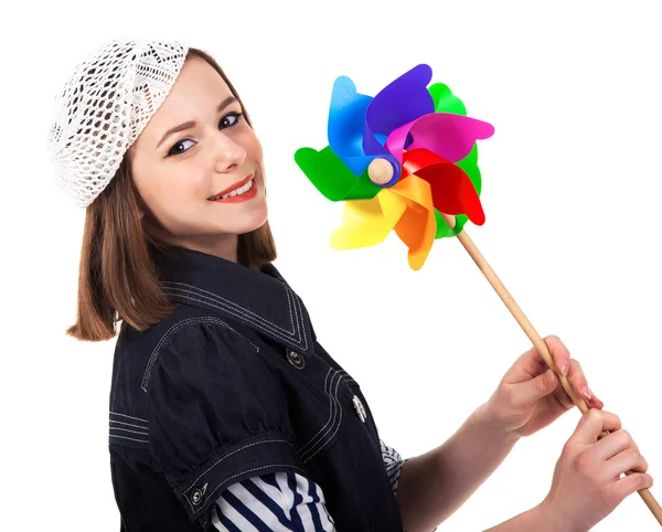 Young cute brunette girl with wind turbine toy — Stok fotoğraf