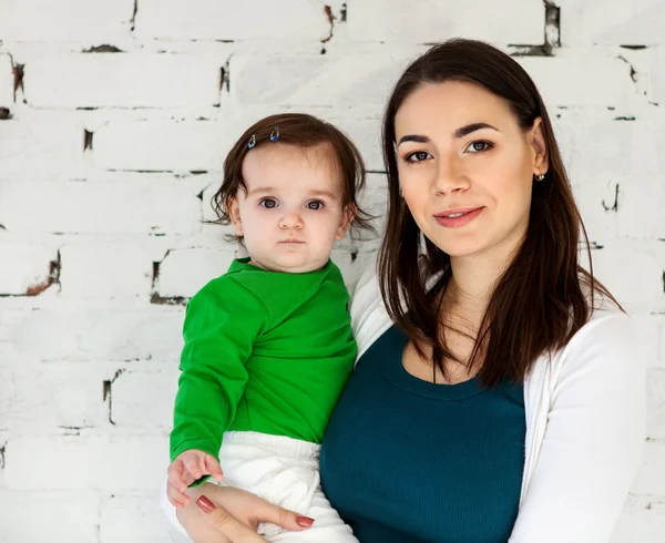 Happy smiling mother with eight months old baby — Stock Photo, Image