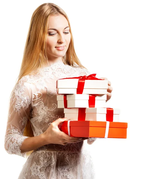 Happy young blond girl with presents — Stock Photo, Image
