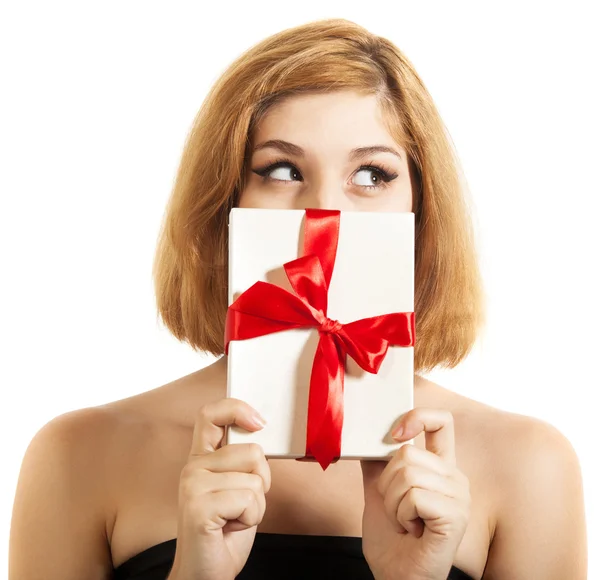 Beautiful young brunette girl holding present — Stock Photo, Image