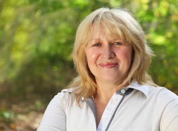 Middle aged woman outdoors — Stock Photo, Image