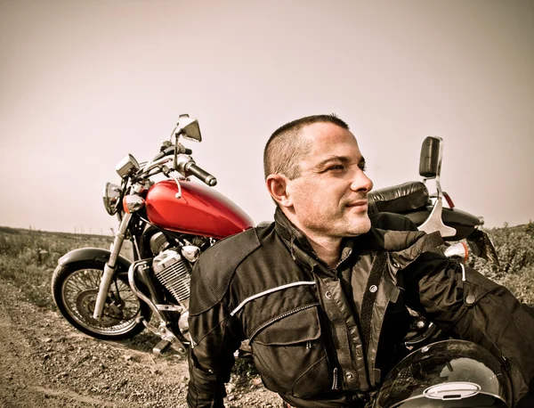 Biker on the country road — Stock Photo, Image