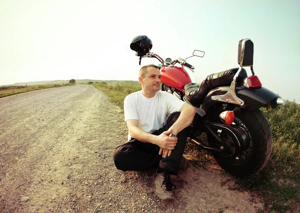 Biker on the country road — Stock Photo, Image