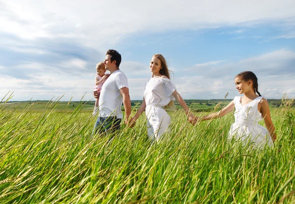 Happy young family outdoors — Stock Photo, Image